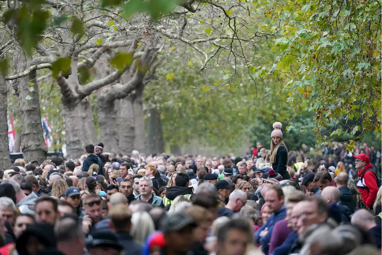 'It's going to be emotional': London crowds celebrate before falling silent at Queen's funeral