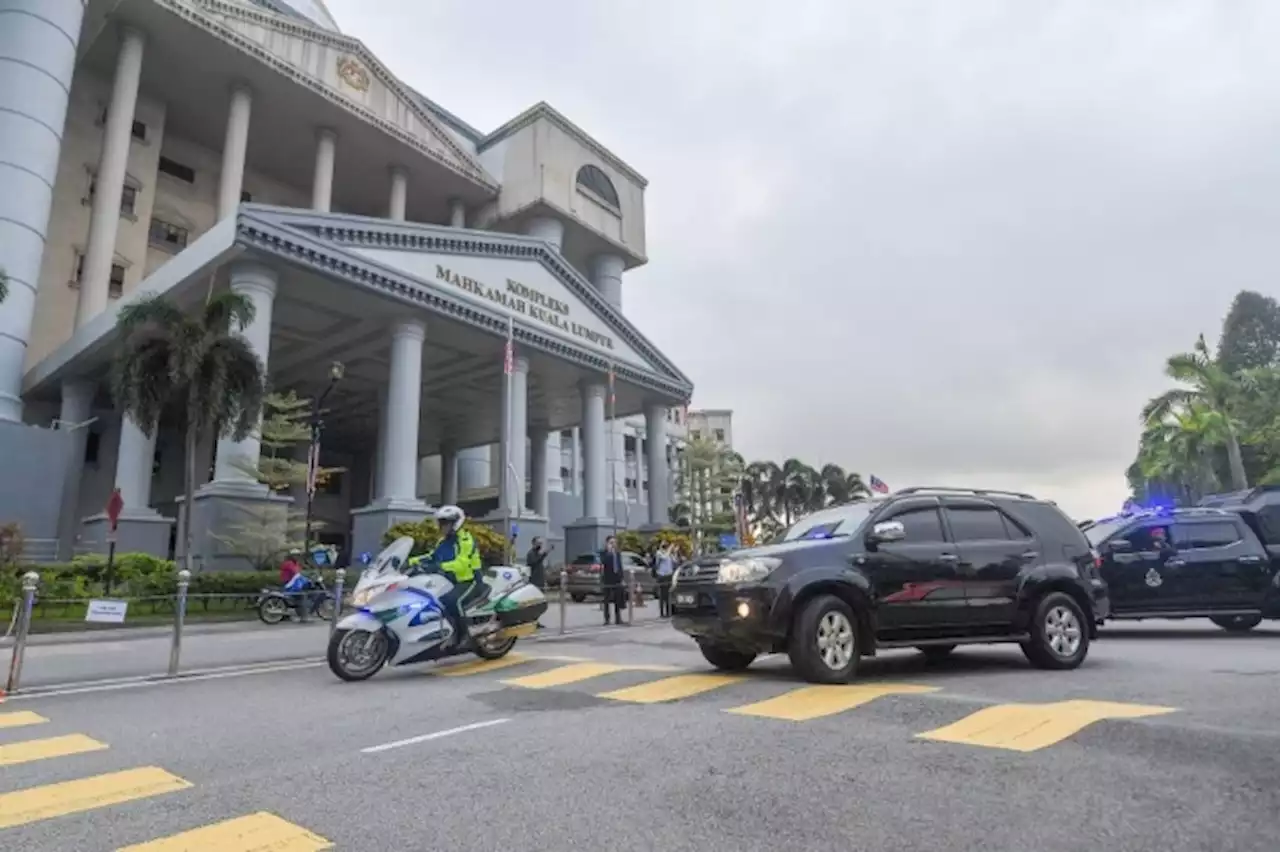 Newly-convicted Rosmah attends Najib's 1MDB audit trial, latter waves to her in courtroom