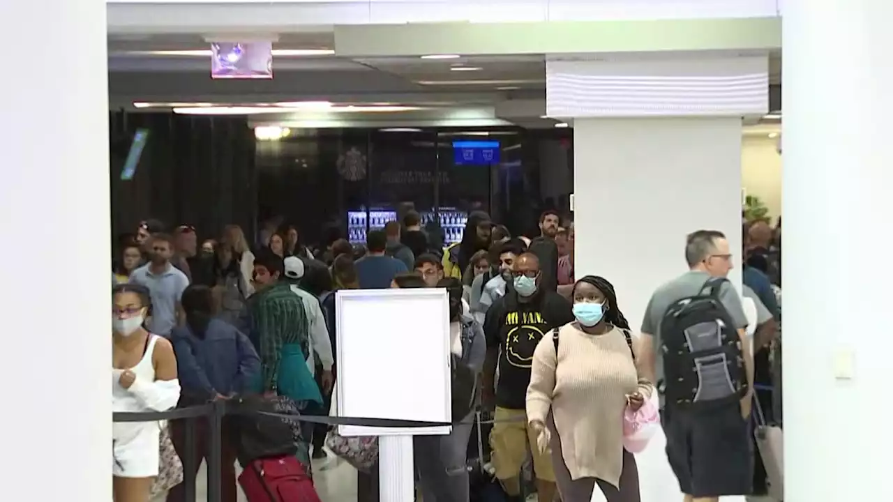 People Line Up for Security Check on Busy Travel Day at Philadelphia Airport