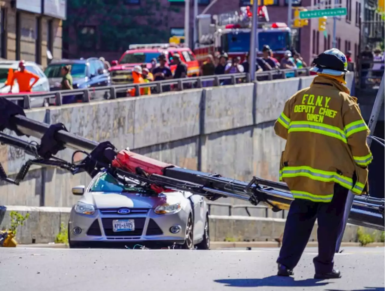 Bronx crane collapse crushes car, injures motorist: FDNY | amNewYork