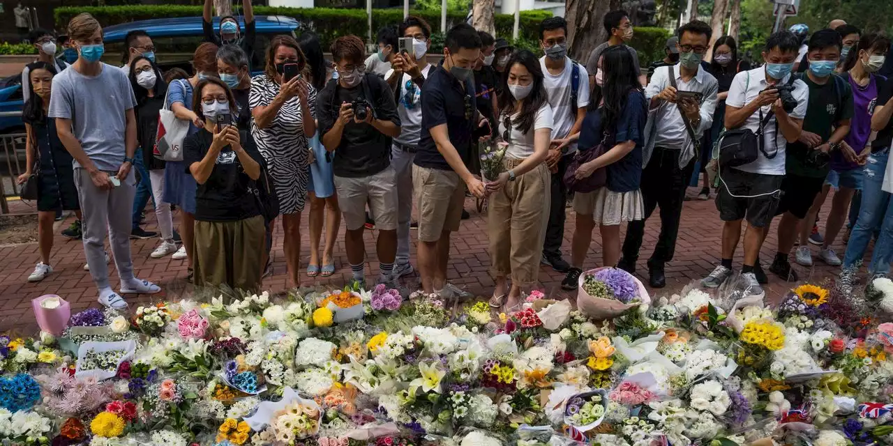 Hong Kong Police Arrest Harmonica Player After Protest Tune Heard at Queen Funeral Vigil