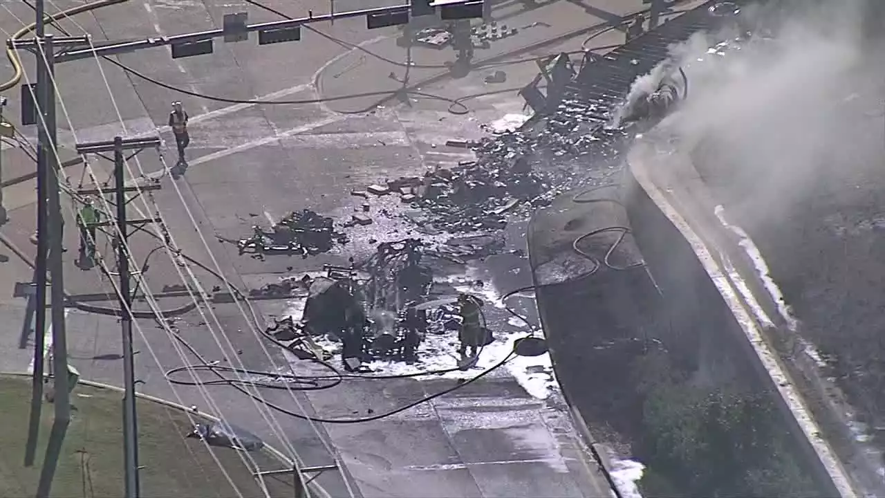 One dead after 18-wheeler flips over US-75 sidewall in Fairview, crashes onto road below