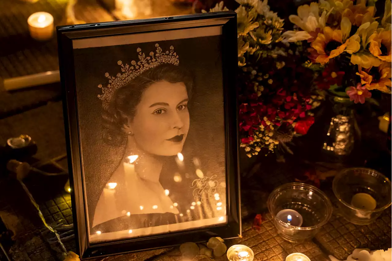 Queen's final resting place marked with slab bearing her name alongside her parents and Philip