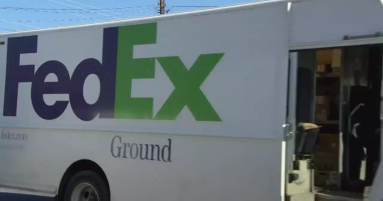 FedEx forecasts a drop in profits, plans to raise fees to cover losses