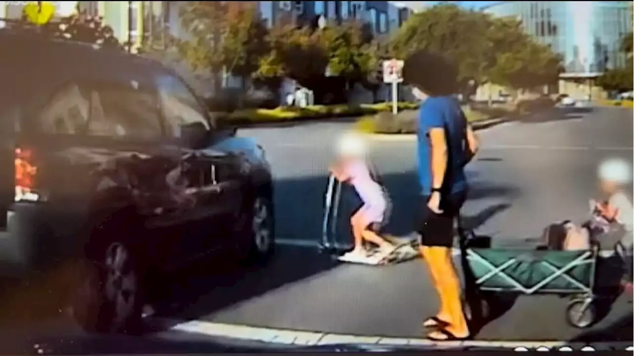 SUV misses child by inches as it barrels through flashing crosswalk | Autoblog