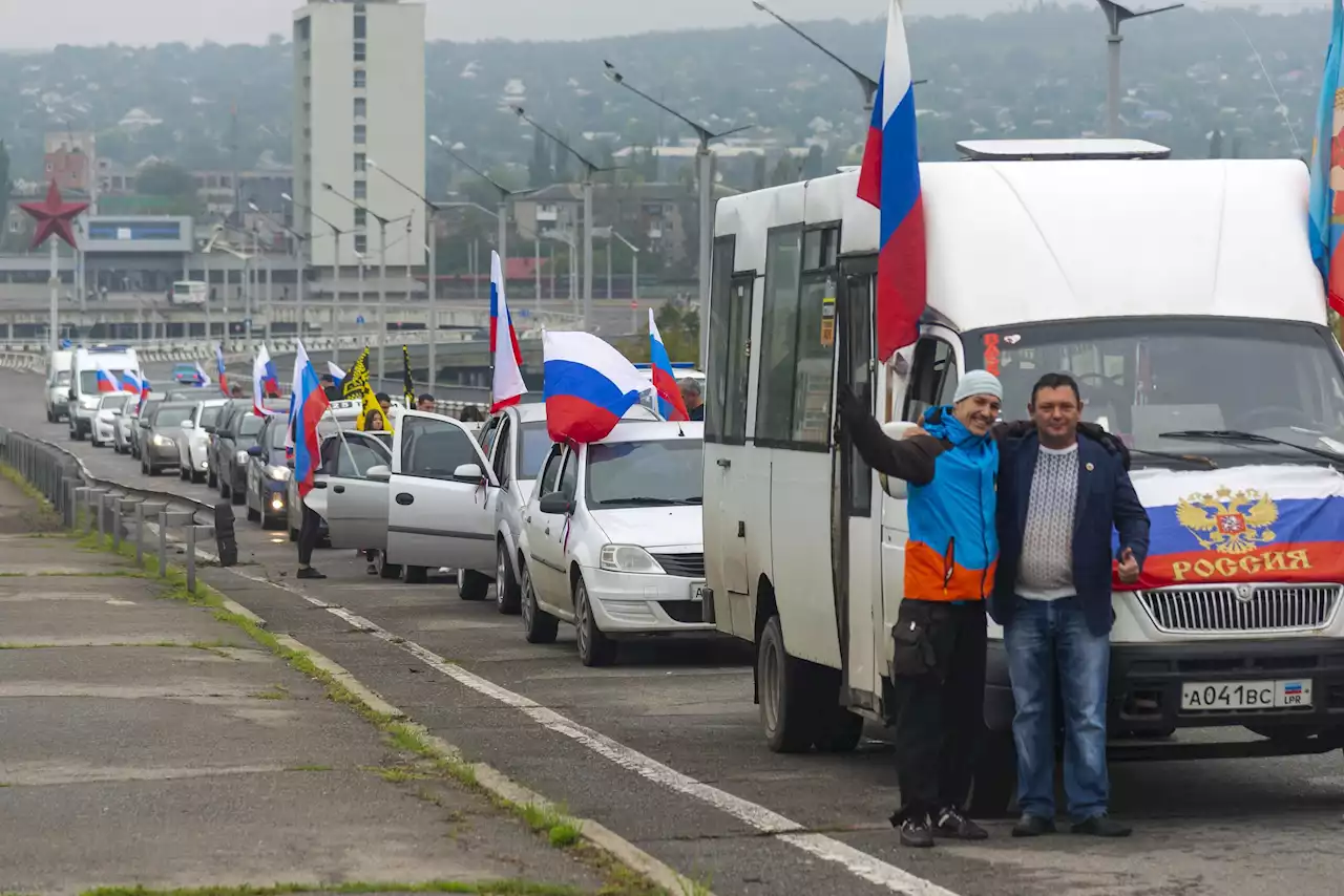 Russia shells Ukrainian cities amid Kremlin-staged votes