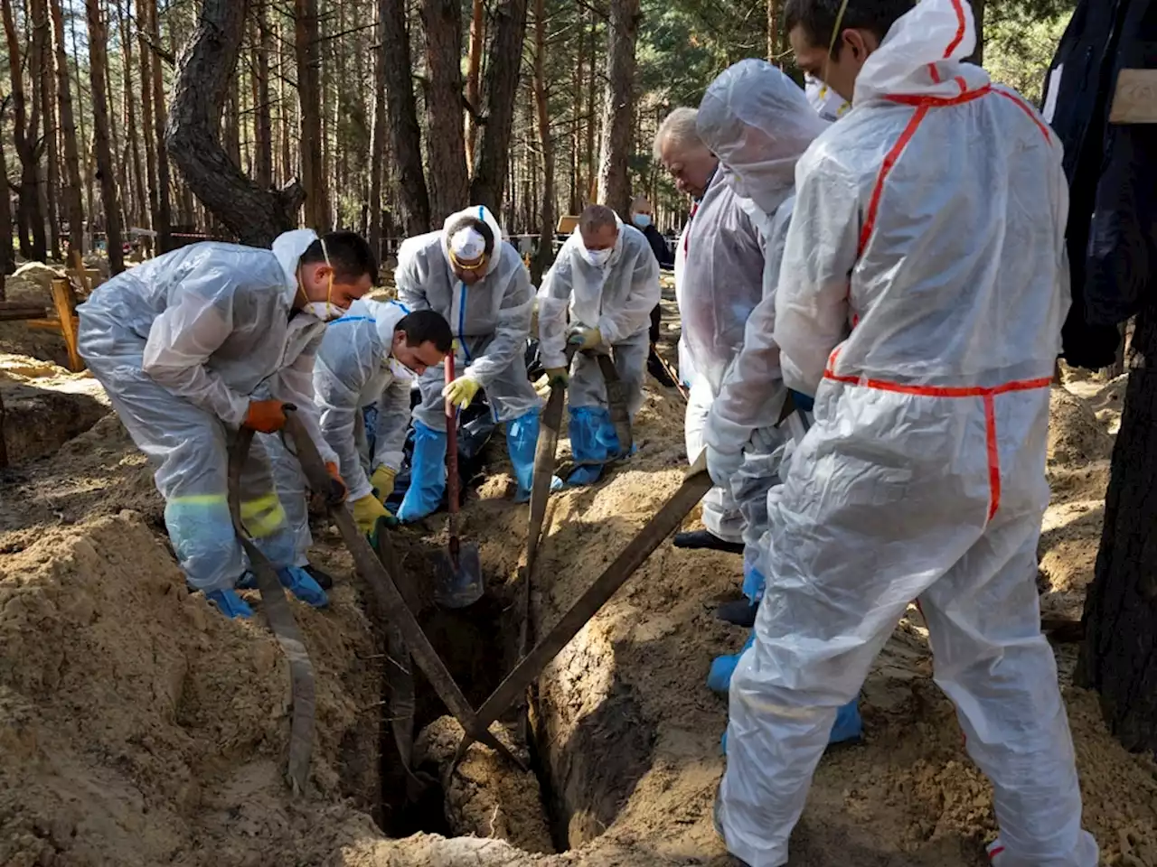 Ukraine says 436 bodies exhumed from mass site; 30 show torture