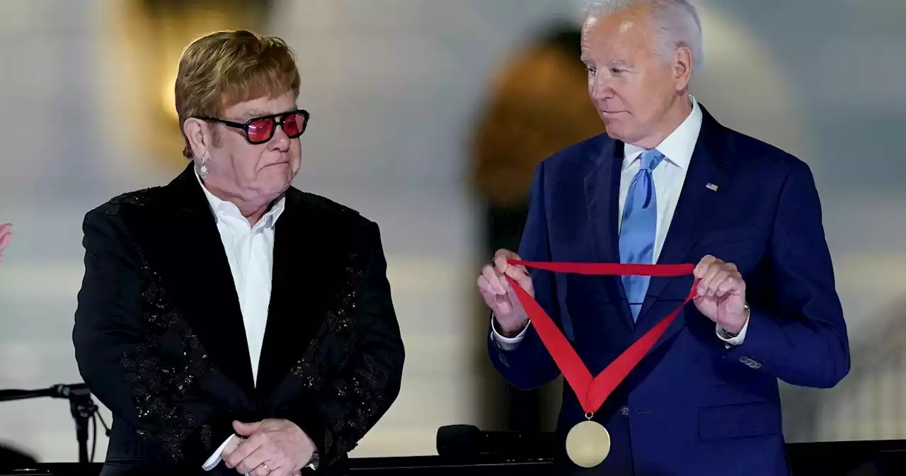 Biden surprises Elton John with National Humanities Medal after White House concert