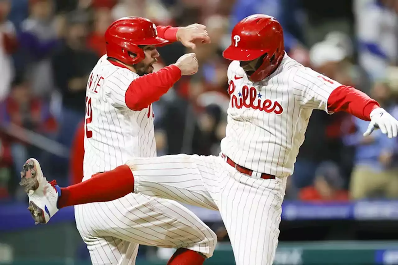 Rhys Hoskins and Aaron Nola slug and sling the Phillies closer to postseason in 9-1 rout of the Braves