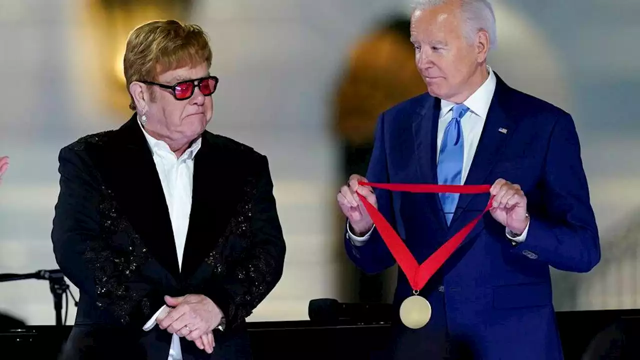 Biden surprises Elton John with National Humanities Medal after White House concert