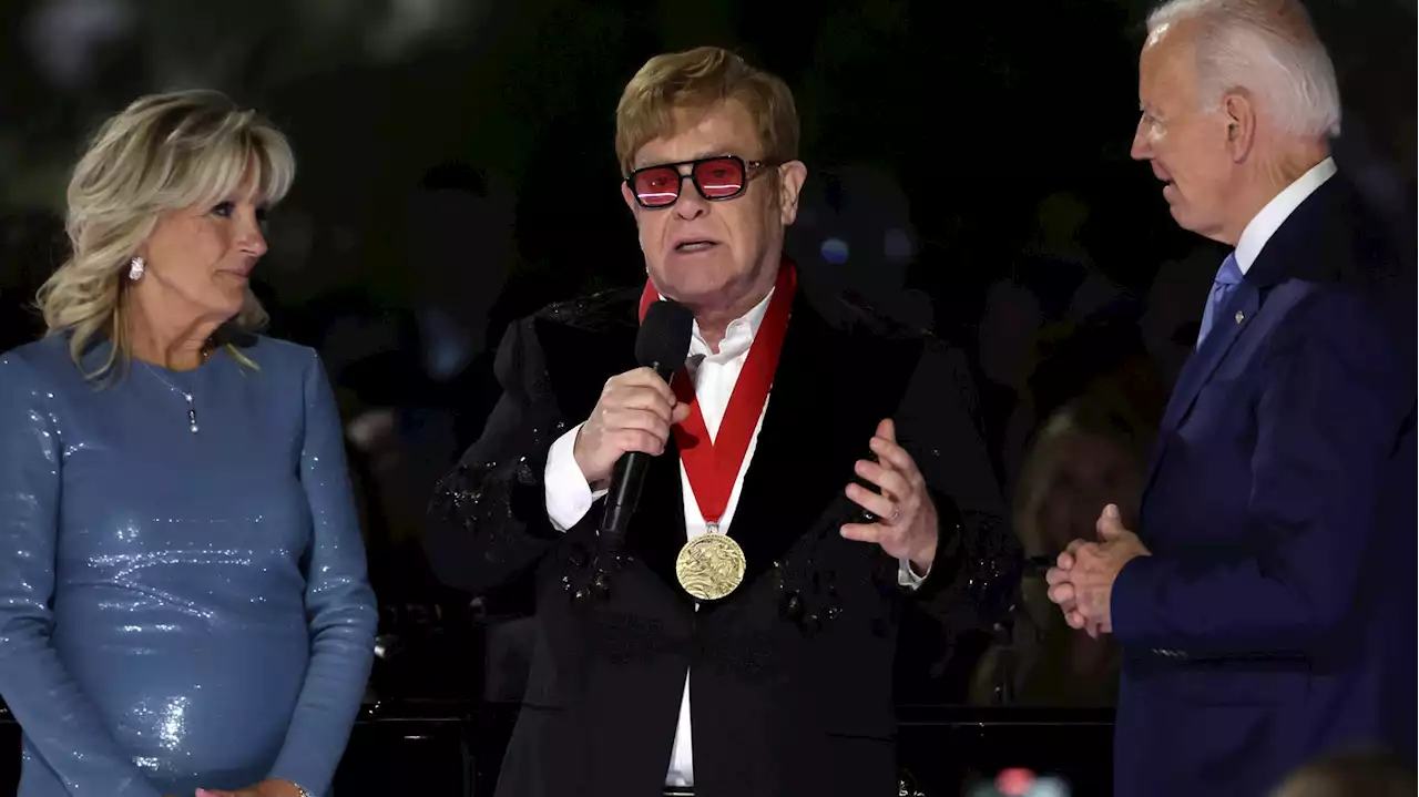 Elton John was moved to tears by a surprise award from President Biden