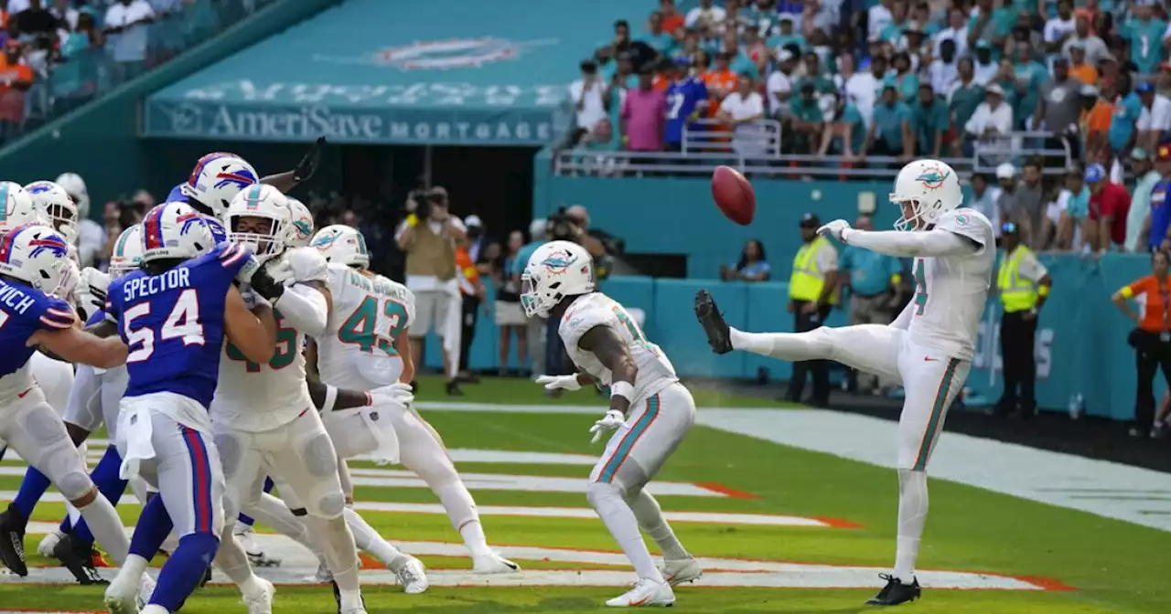 Dolphins survive 'butt punt' to beat Bills