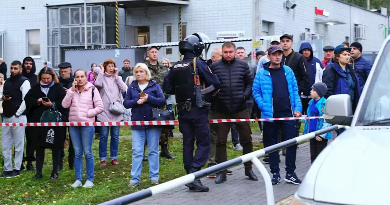 Swastika-wearing gunman kills 13, wounds 21 in school shooting in Russia, officials say