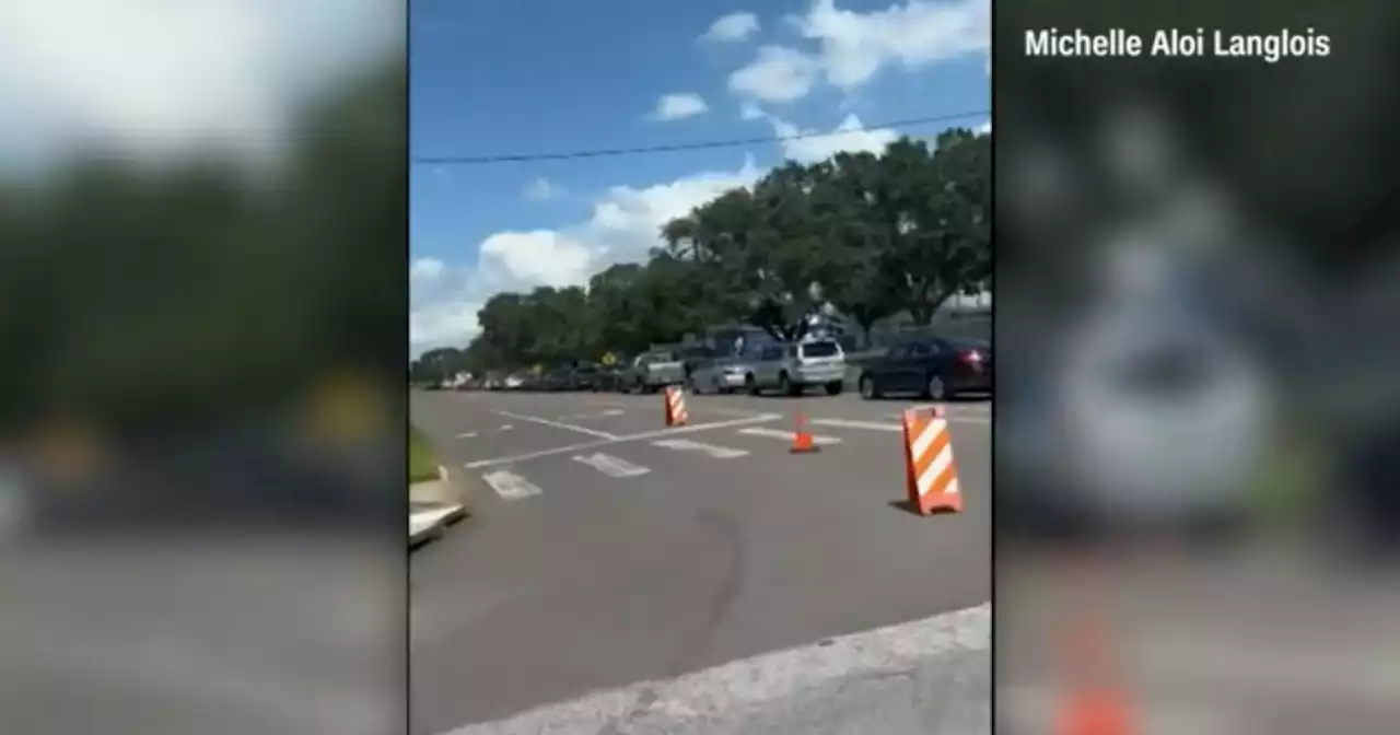 Florida residents wait in long lines for sandbags ahead of Hurricane Ian