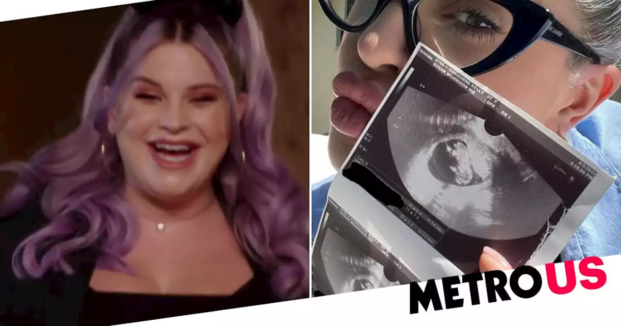 Glowing Kelly Osbourne cradles baby bump in new Red Table Talk episode