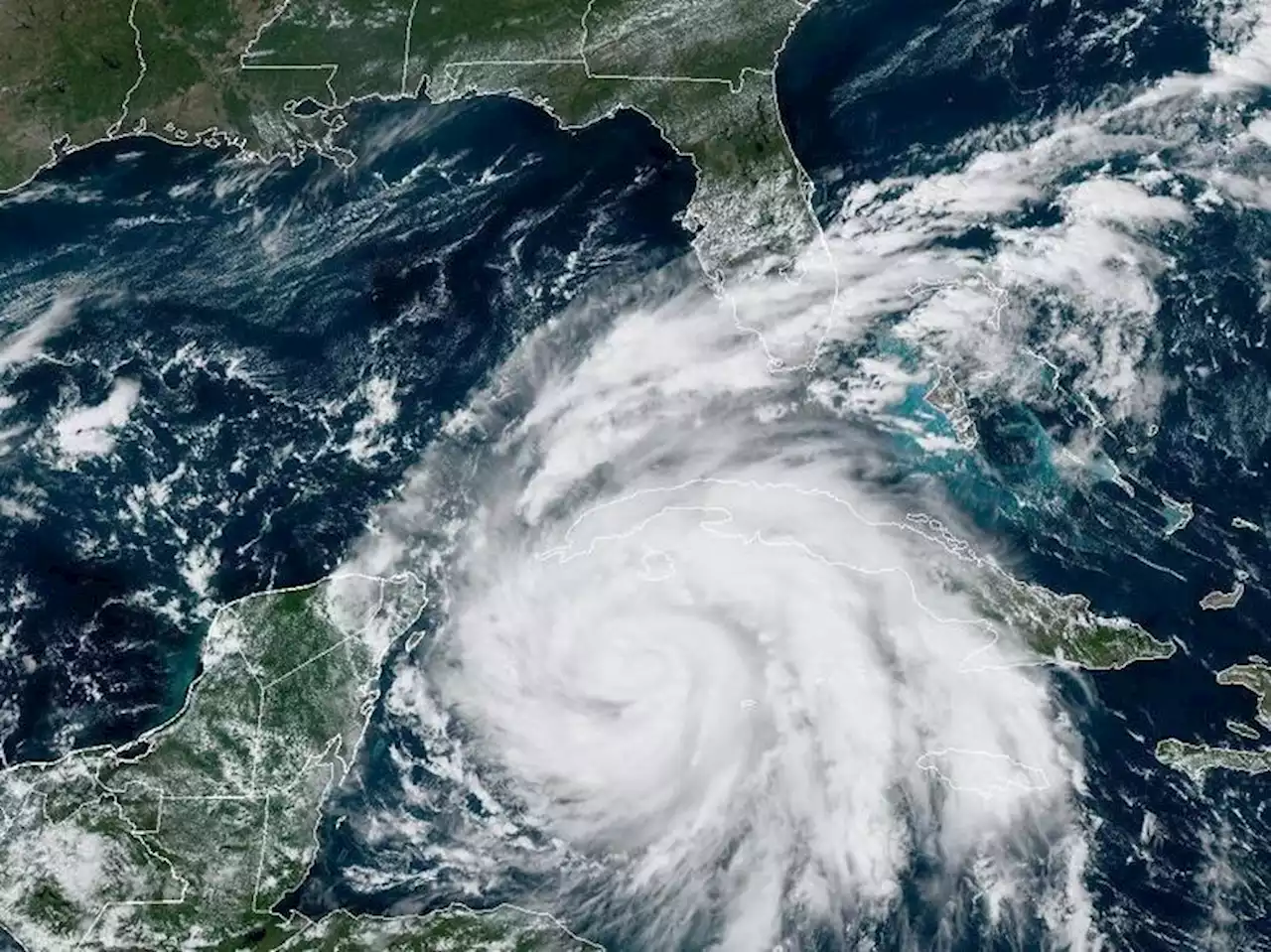 Hurricane Ian strengthens to a Category 3 storm as it takes aim at Florida