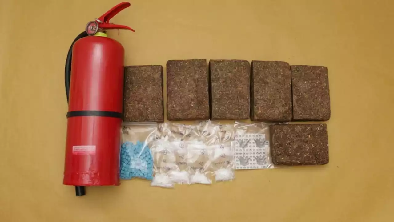 Cannabis hidden in fire extinguisher among 13kg of drugs seized in CNB raids