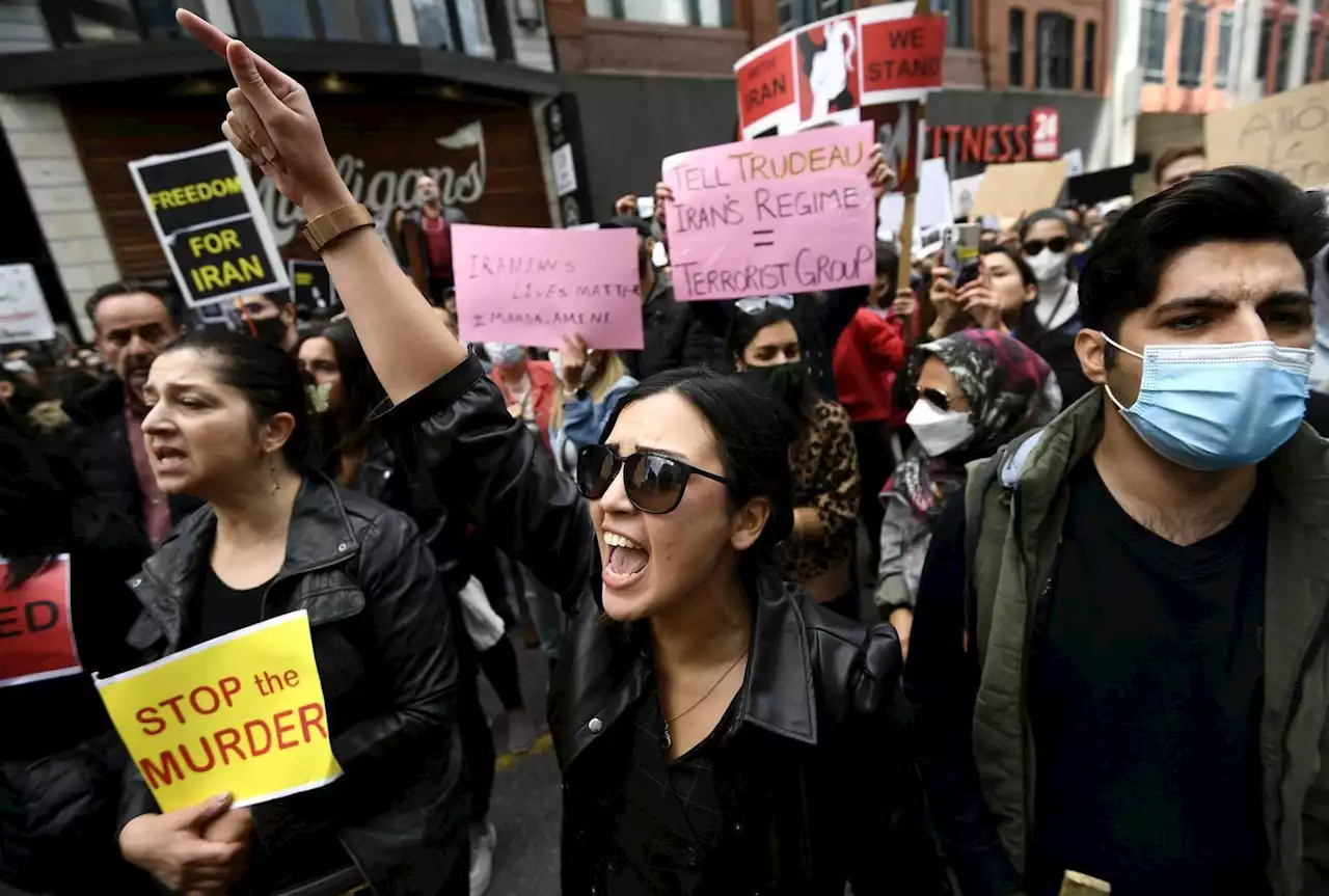 'Every one of us was a Mahsa': Iranians in Canada cut hair at women's rights rallies