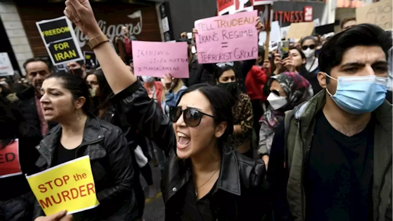 'Every one of us was a Mahsa': Iranians in Canada cut hair at women's rights rallies