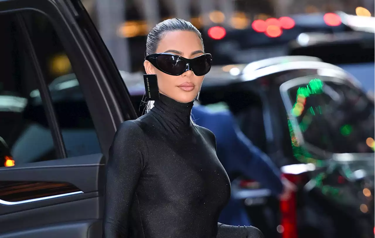 Kim Kardashian Has To Go Topless Just To Text While Wearing This Outfit