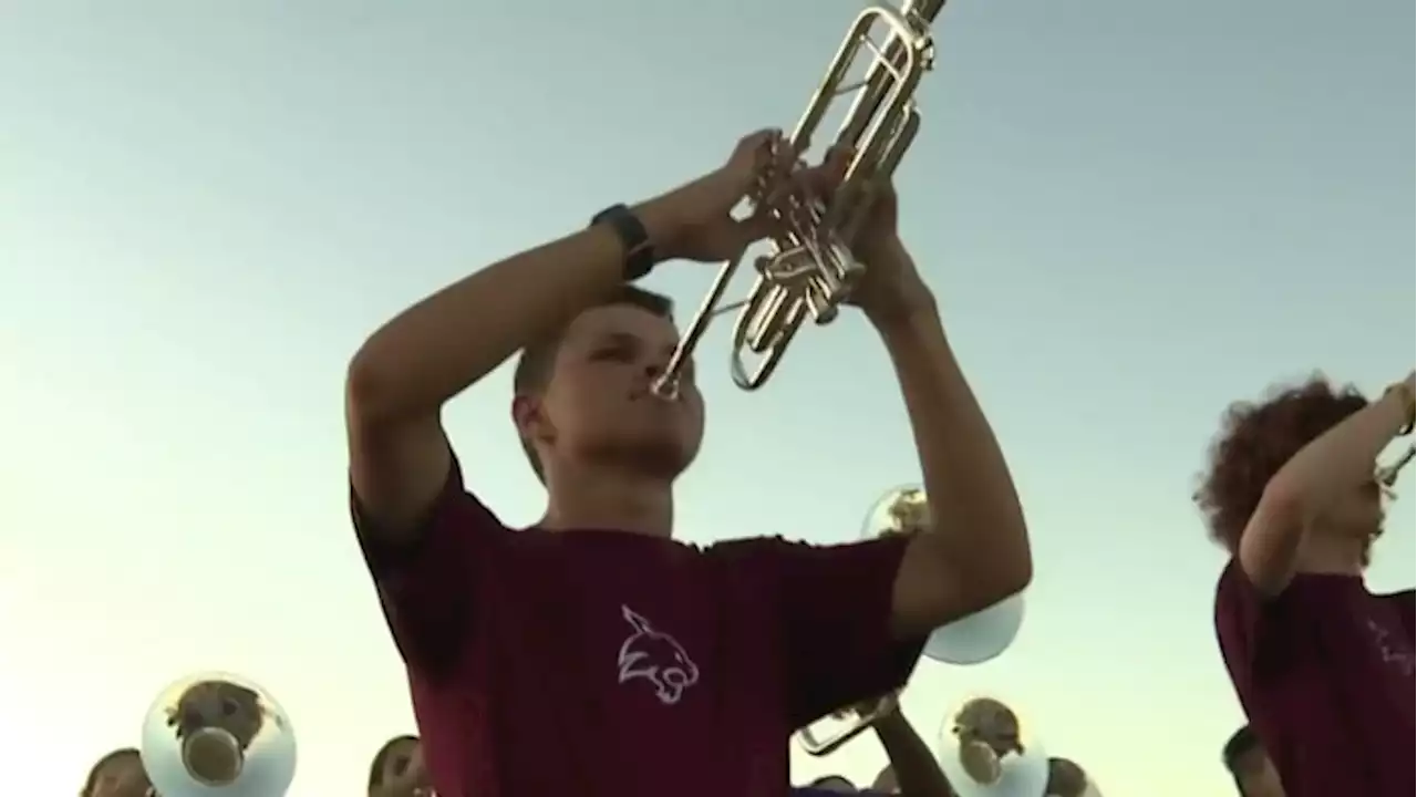 Cy-Fair HS marching band works as team to help blind band member