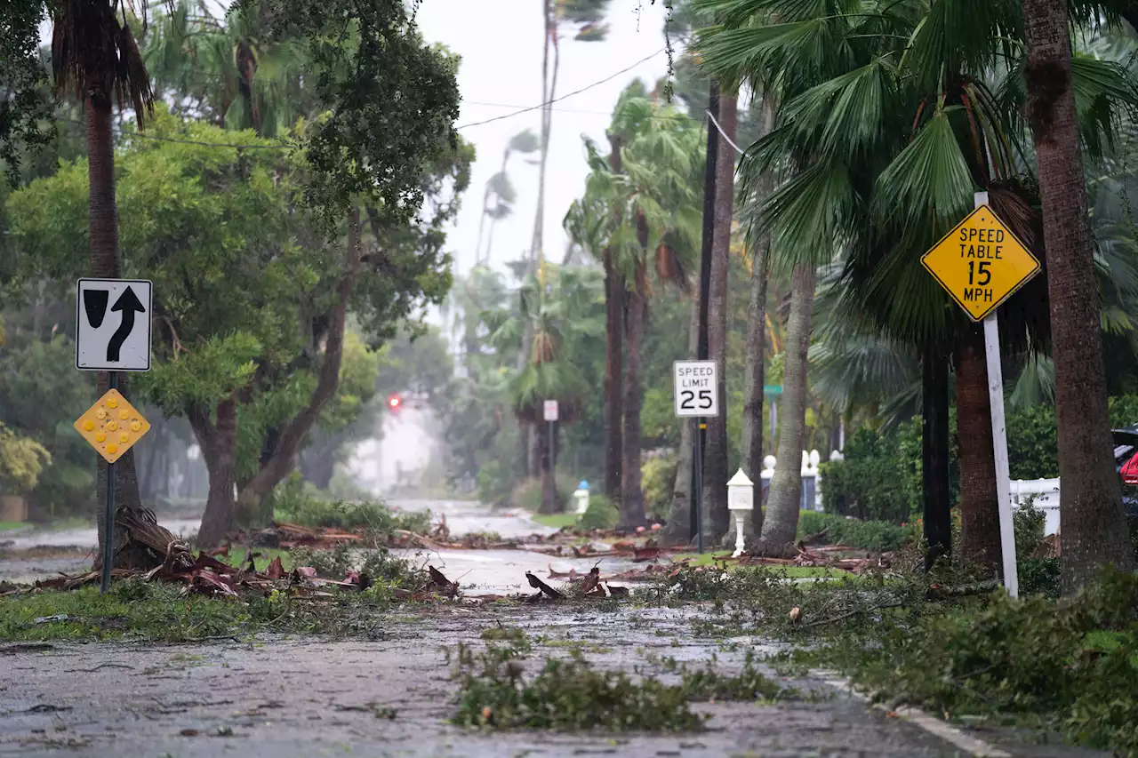 Videos show homes 'floating down streets' as Hurricane Ian pummels Florida