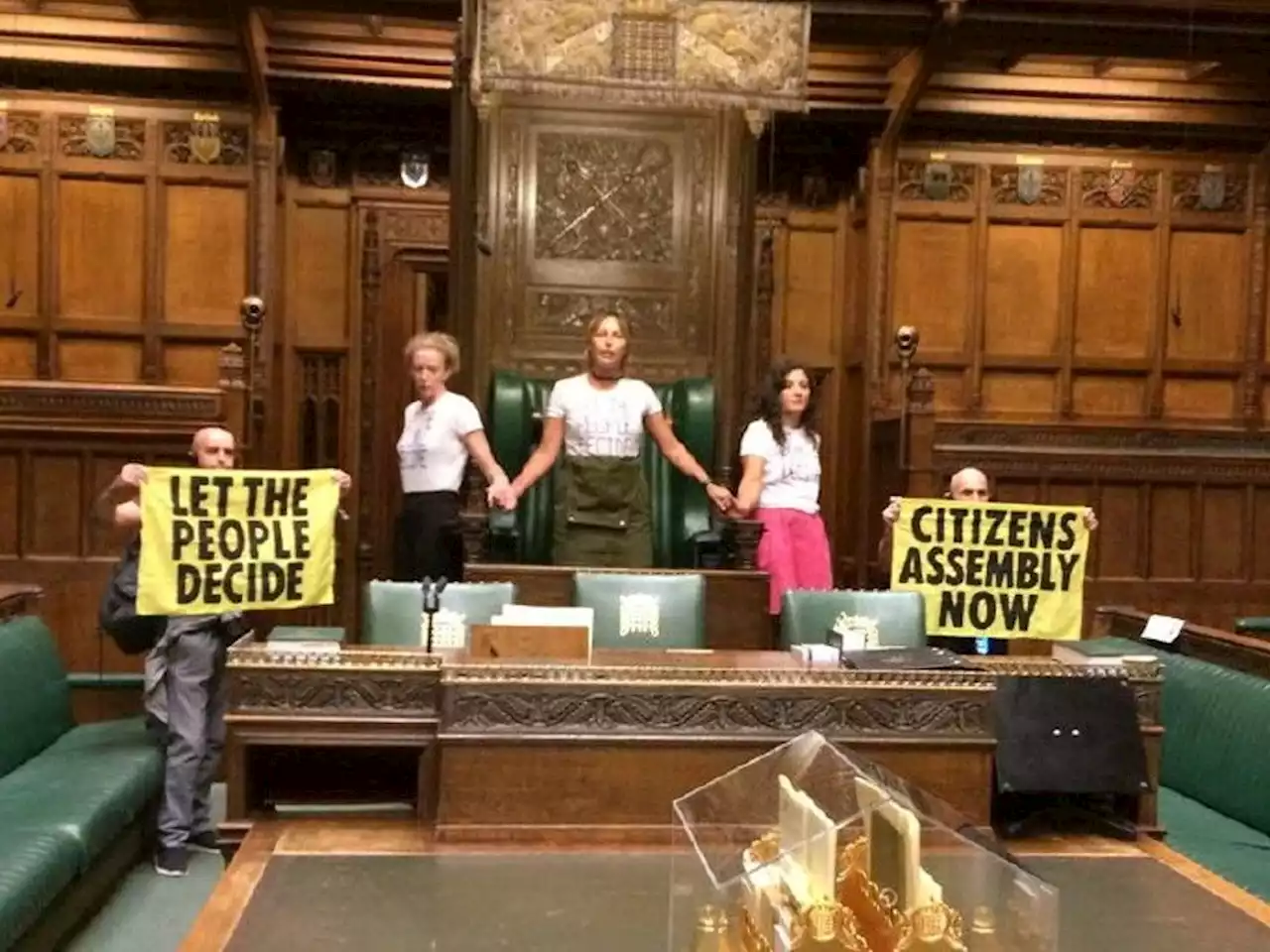 Extinction Rebellion activists 'superglue' themselves around Speakers Chair inside U.K. Commons chamber