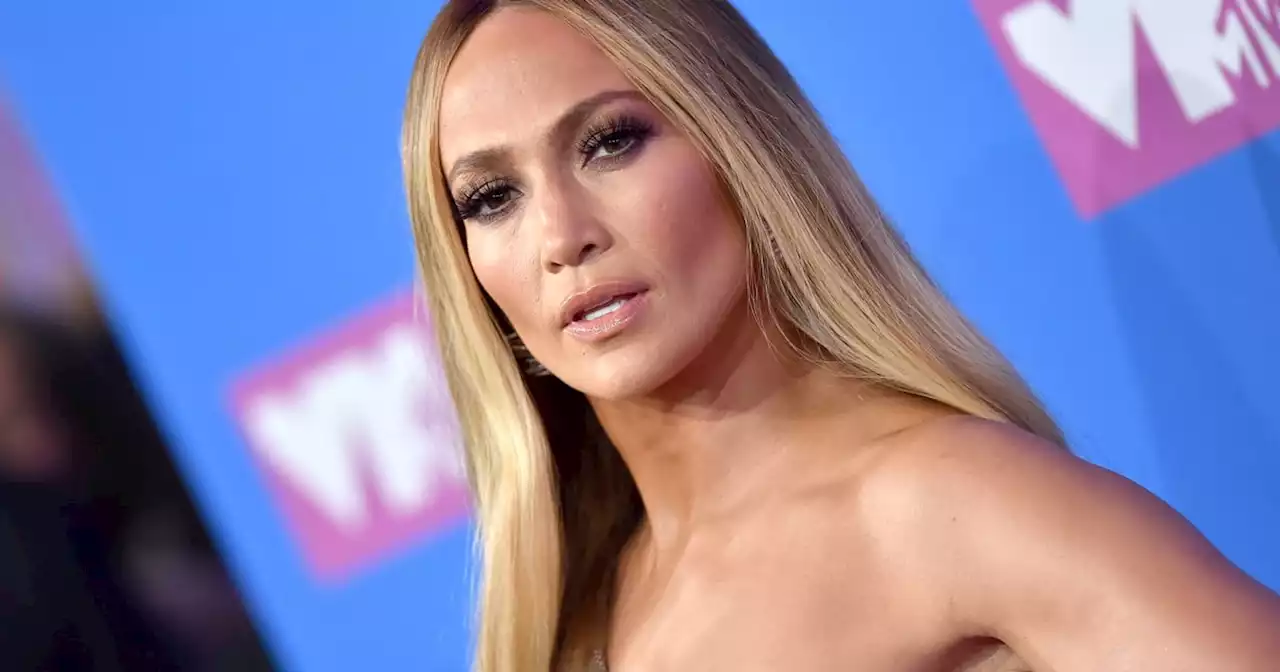 J Lo Stuns in a Plunging Gold Halter Gown at Her Wedding Rehearsal Dinner