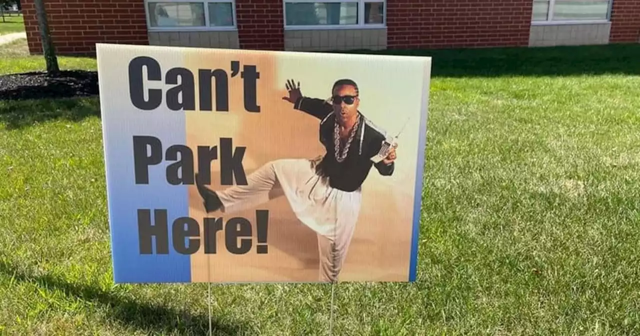 Elementary school makes parents laugh in carpool line with celebrity-inspired signs