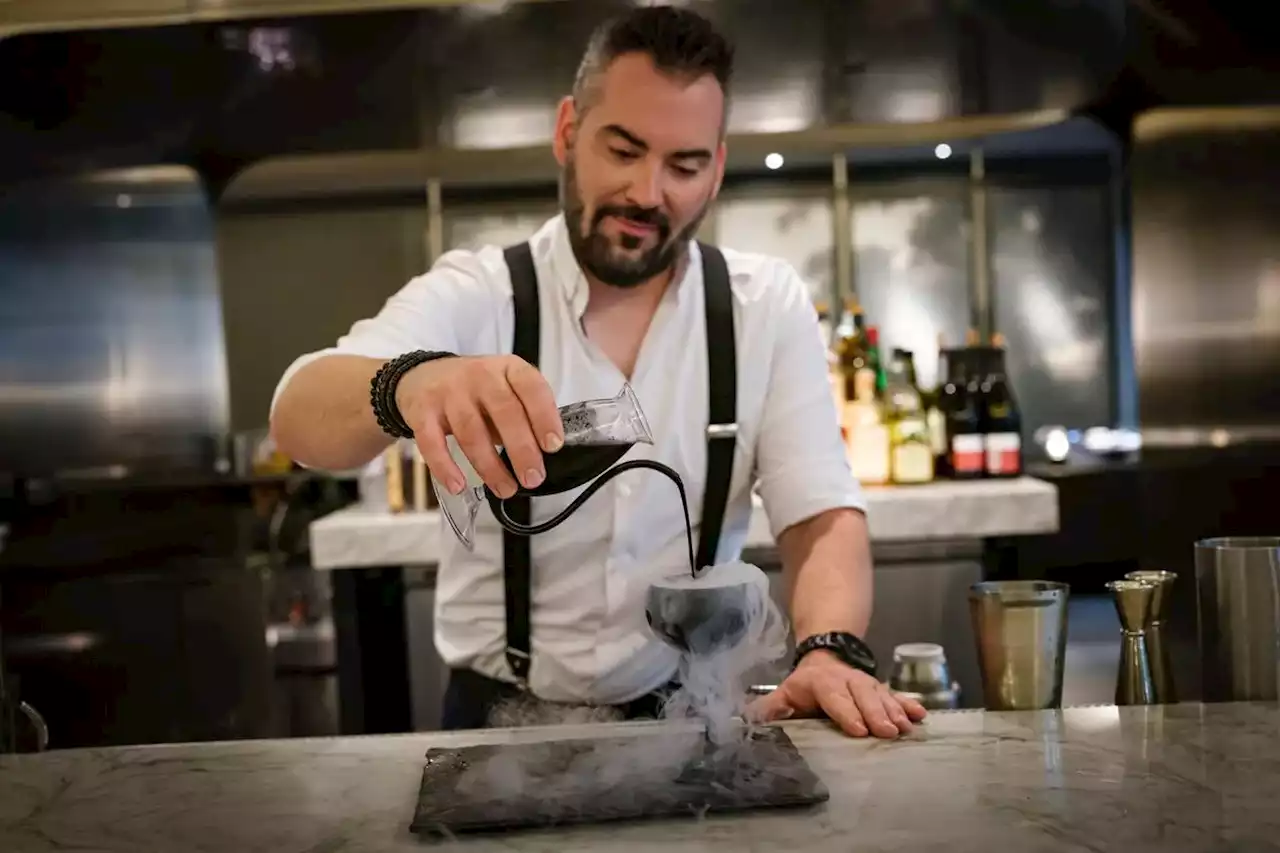 This $70 TIFF-themed cocktail features gin, saké, yuzu, activated charcoal and a liquid nitrogen smoke effect