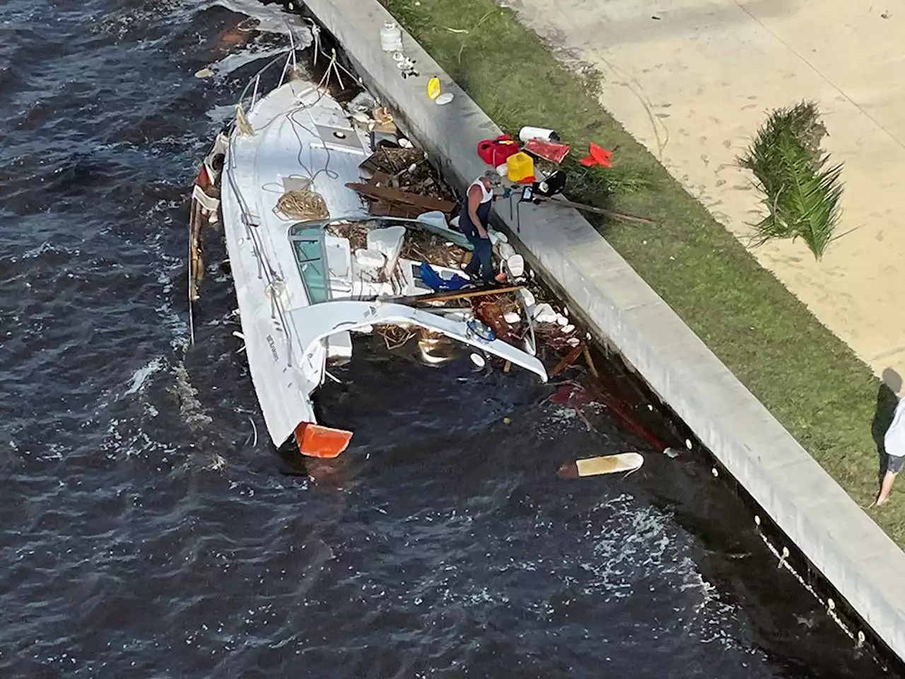 Hurricane Ian footage shows thrill-seeking swimmers, yachts swept in streets