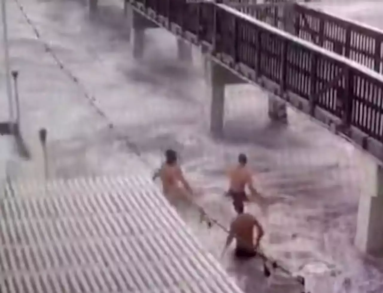 Hurricane Ian footage shows thrill-seeking swimmers, yachts swept in streets