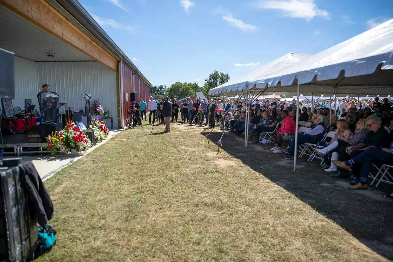 Hundreds gather beside N.J. airport runway to honor father and son killed in plane crash