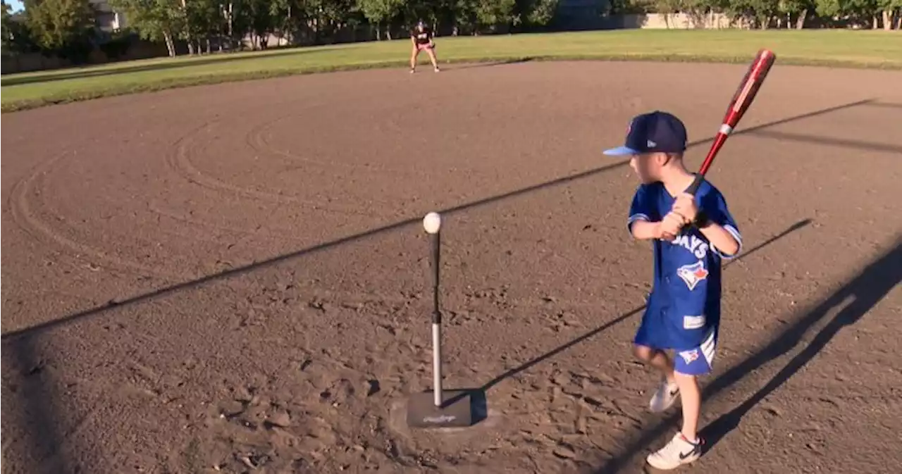 Saskatchewan boy with three open heart surgeries throws out first pitch at Blue Jays game | Globalnews.ca