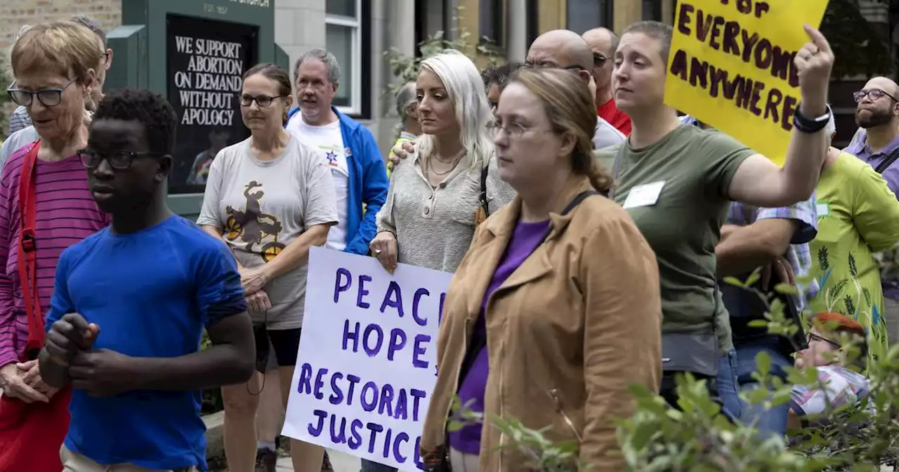 Vandals shattered an abortion rights sign at an East Lakeview church. Clergy responded with an interfaith rally supporting the right to choose.