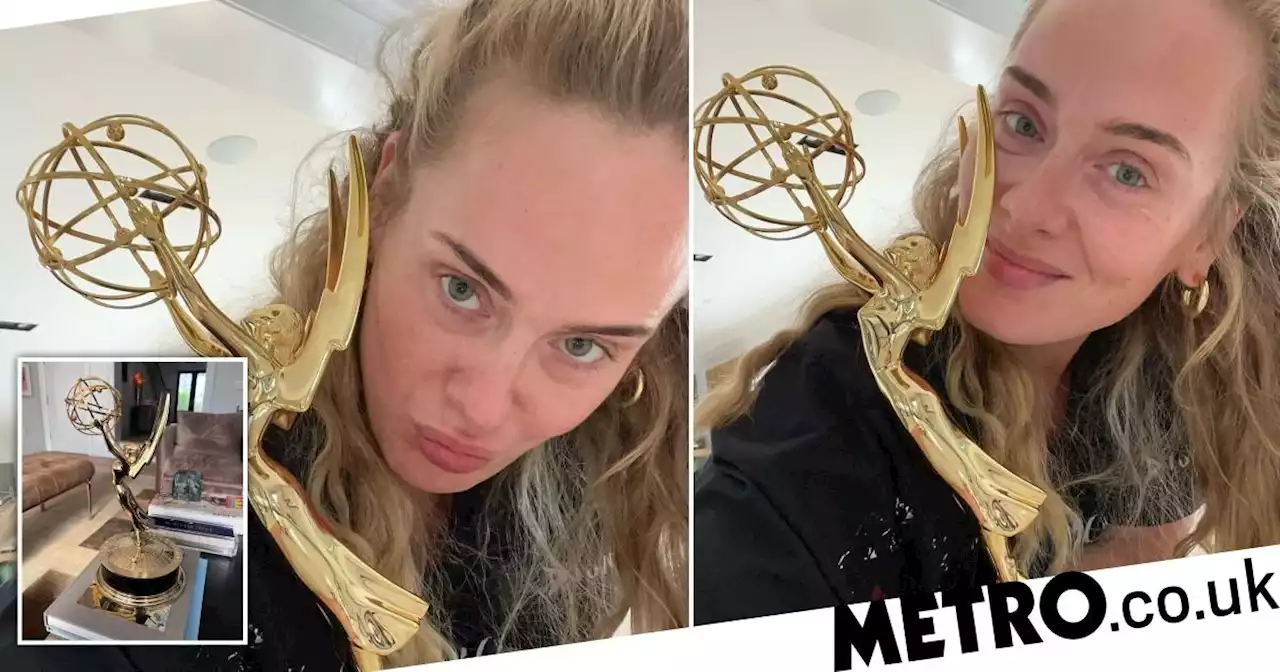 'Trust me to have an EGO': Adele 'pleased as punch' as she poses with first Emmy