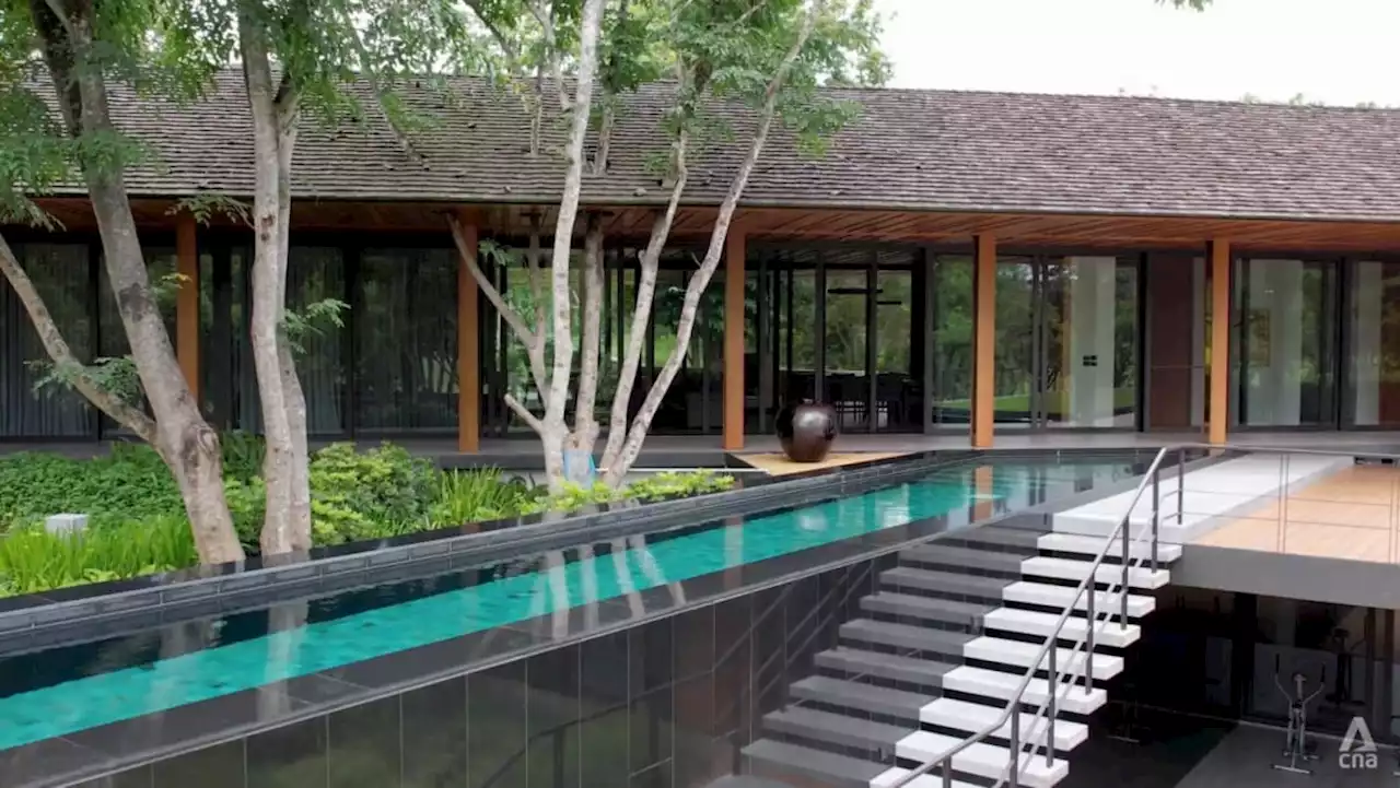 A swimming pool takes centre stage at this tropical modernist architecture in Thailand