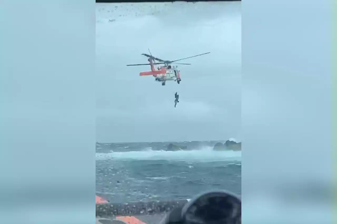 Stranded fisherman clinging to rock saved by Coast Coast during Tropical Storm Earl