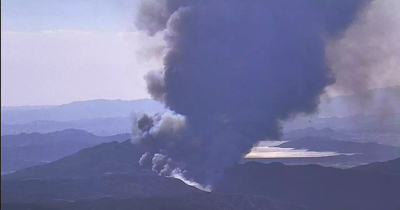 Two dead, multiple structures burn as fast-moving fire in Hemet explodes