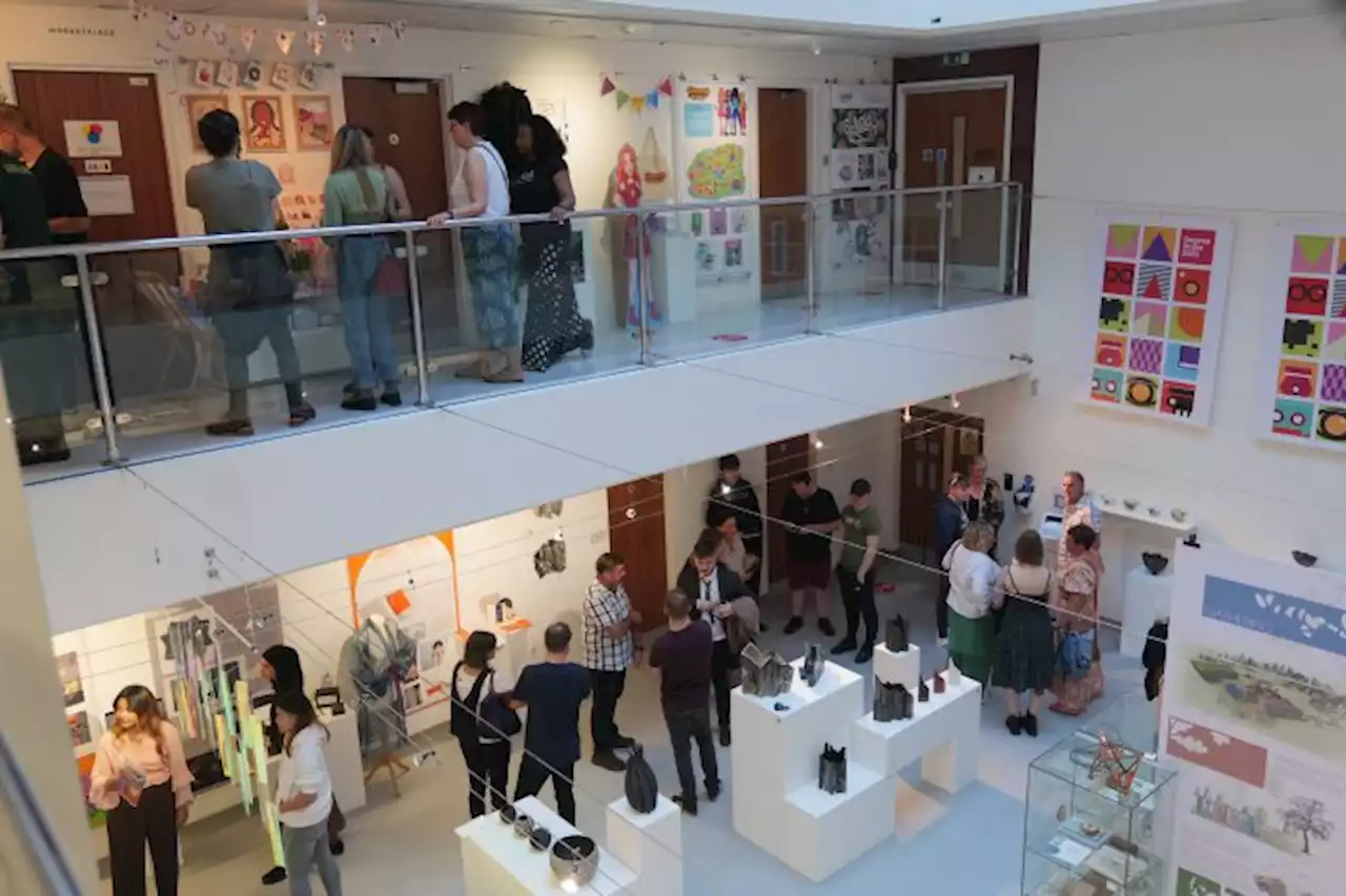 Students and staff celebrate the launch of UCLan’s MA Degree Show