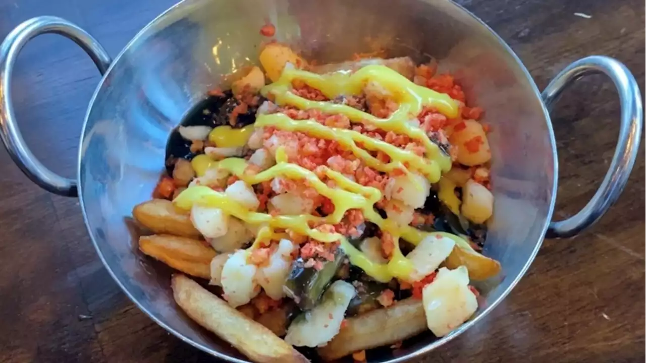 Would you eat this black, red and gold poutine at an Ottawa Senators game?