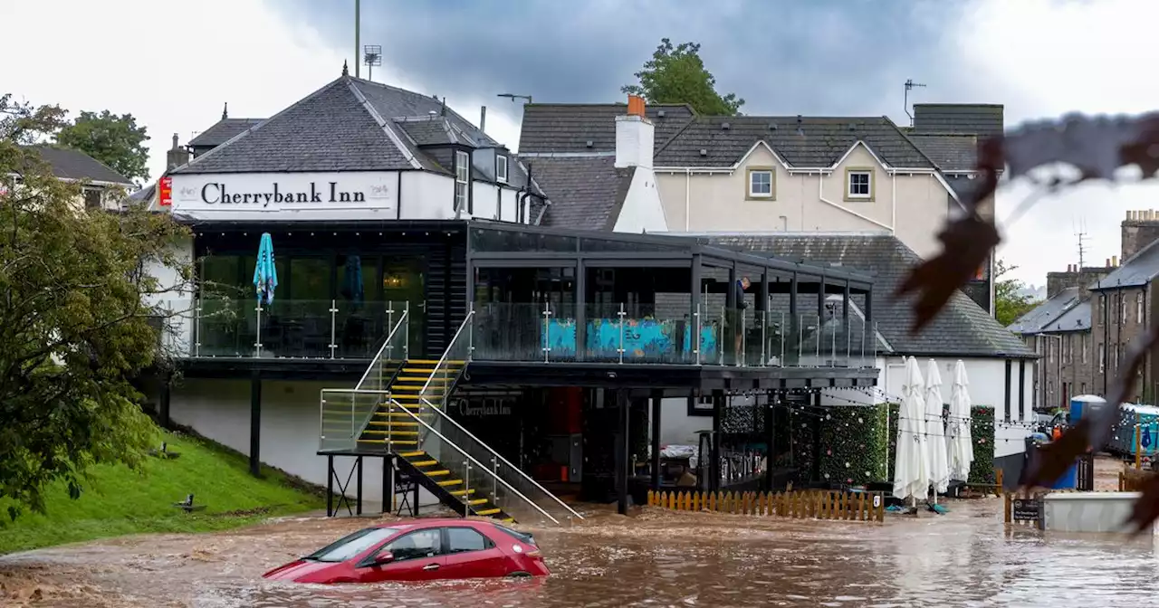 Pub beer garden flooded as Scots stranded with roads closed and trains cancelled