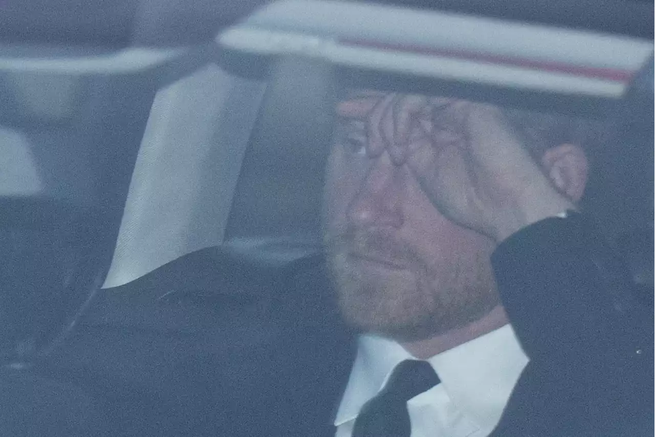 Harry holds his head as he travels to Balmoral after learning of Queen's death