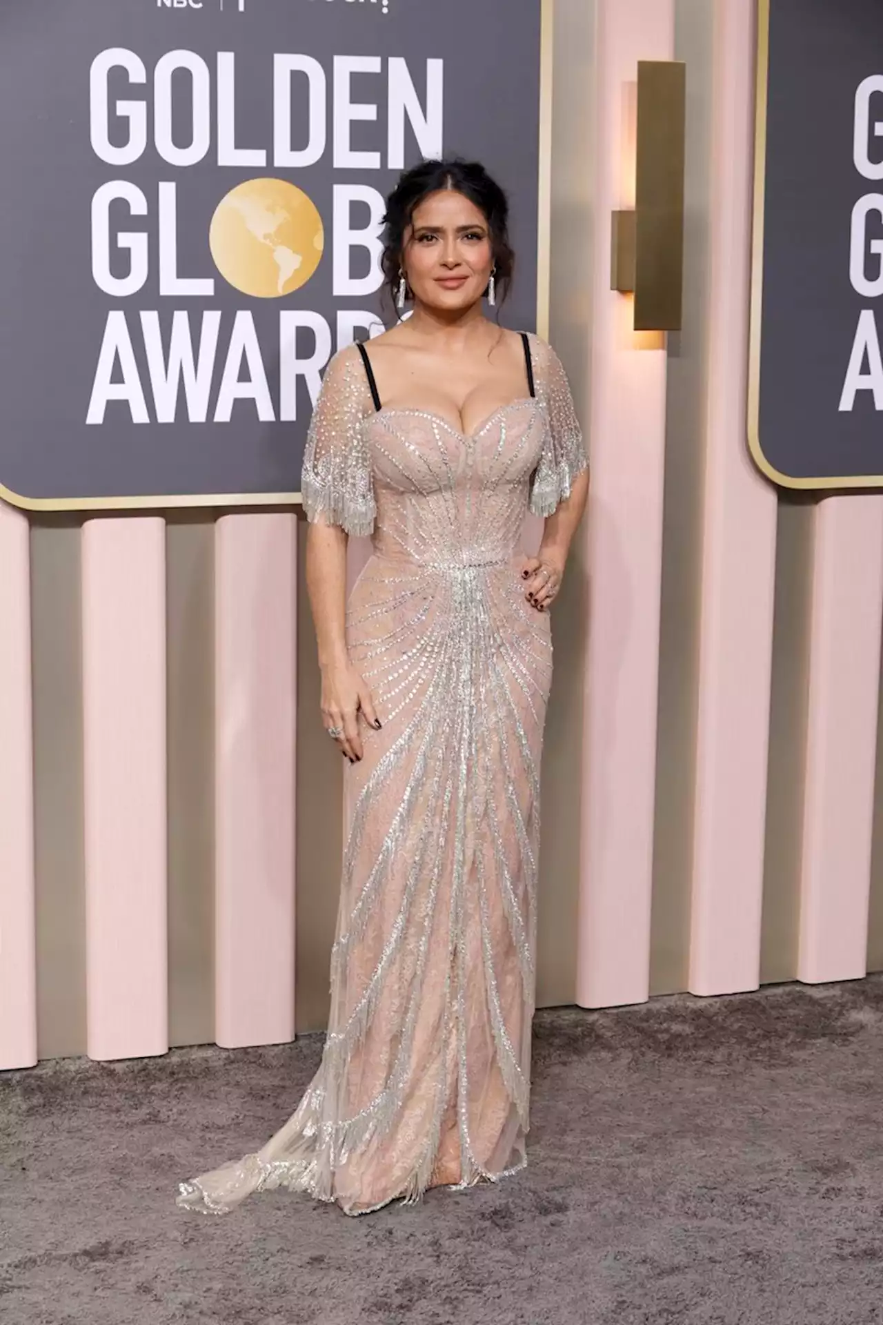 Salma Hayek walked the Golden Globes red carpet in a sheer corset gown