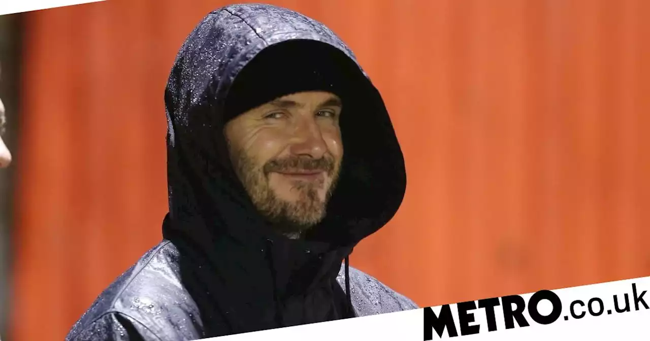 David Beckham jumps over fence after being mobbed watching Romeo play football