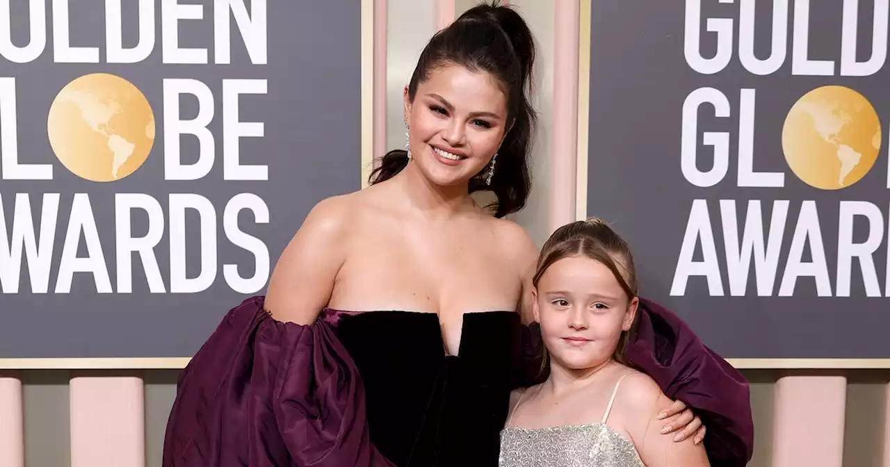 Selena Gomez sweetly kisses sister Gracie, 9, as she brings her to Golden Globes