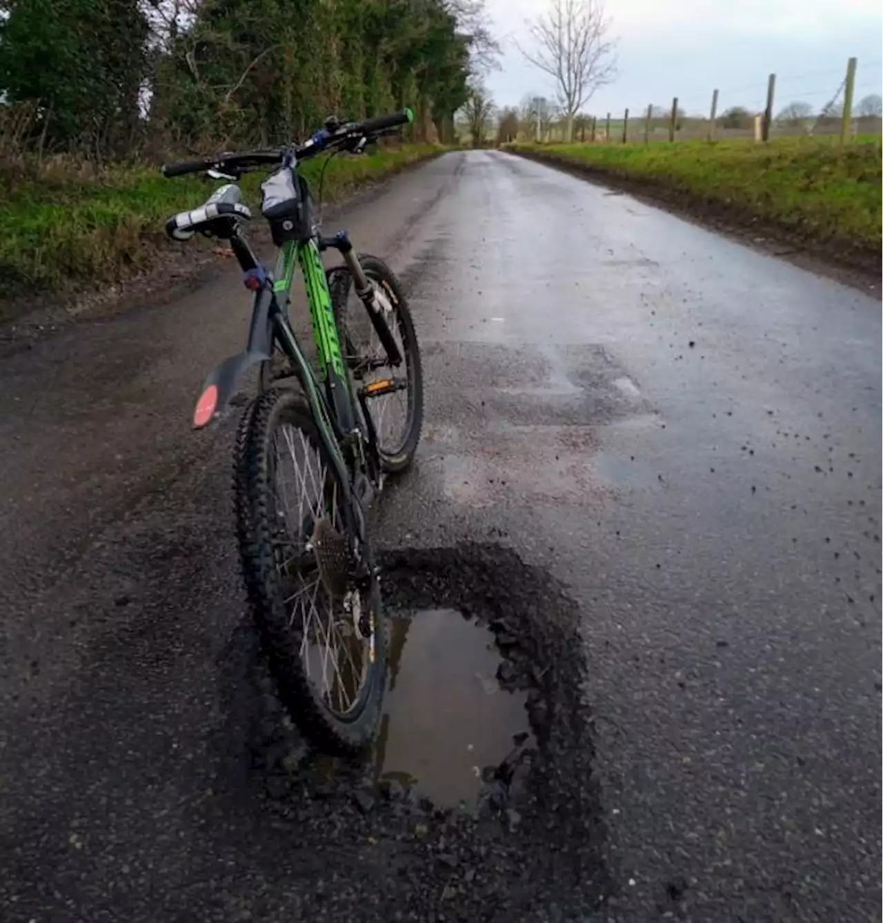 Pothole “so deep I can park my bike in it” branded a “danger to life” by cyclist