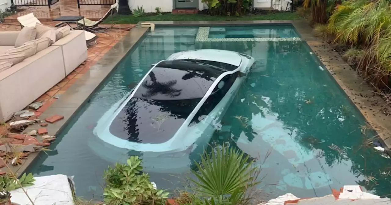 Tesla Smashes Through Wall, Lands in Swimming Pool