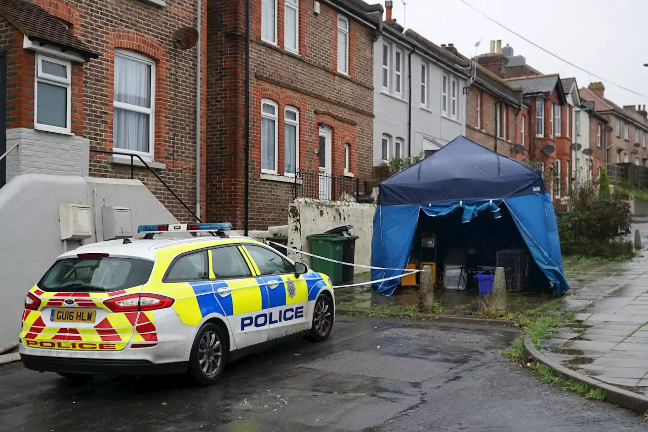 Boy arrested on suspicion of murder after woman in 50s found dead at home