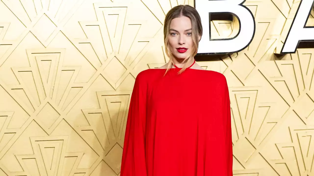 Margot Marks A New Style Direction In Red Hot Valentino